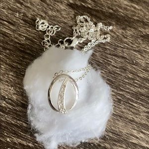 Silver tone with crystal accent